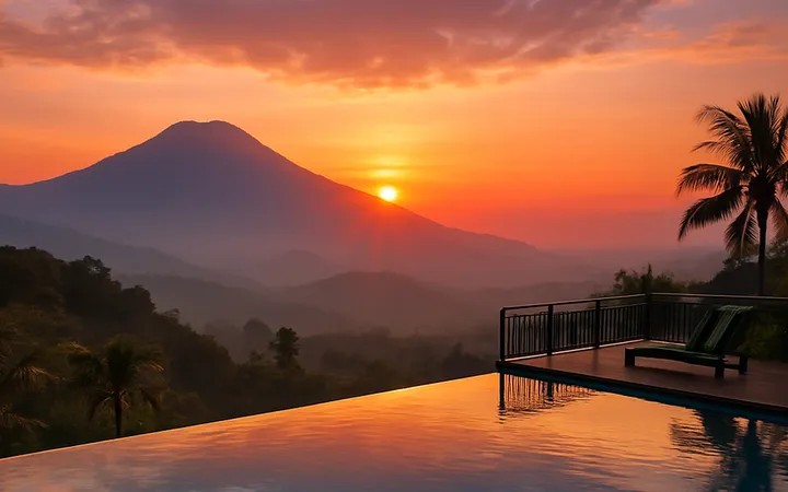 Kolam renang infinity villa dengan pemandangan lembah dan lampu kota di malam hari di Bogor.