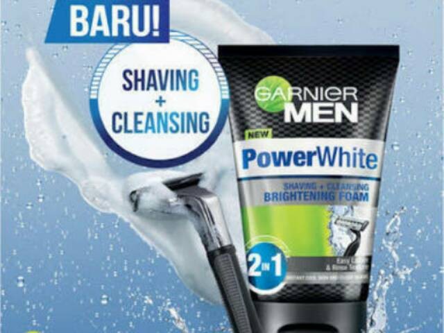 Gambar tube Garnier Men Power White Shaving + Cleansing Brightening Foam dengan desain maskulin dan berani, menonjolkan bahan dasar arang dan sifat pembersihan mendalamnya, mungkin dengan tekstur aran