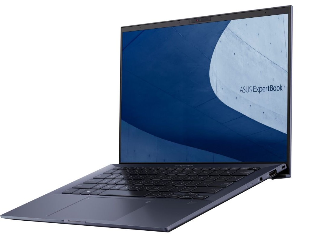 Gambar ASUS ExpertBook atau laptop ASUS yang tangguh serupa di lingkungan luar ruangan atau lokasi konstruksi, menonjolkan daya tahannya, dengan latar belakang Pacific Place Jakarta Selatan.