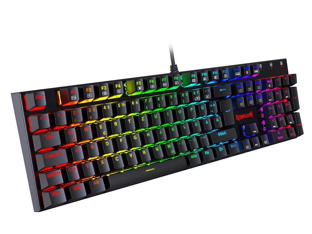 Gambar keyboard mekanik yang ramping dan gelap dengan indikator 'diam' halus atau representasi peredam suara, ditempatkan di meja kantor modern, menyiratkan lingkungan kerja yang damai.