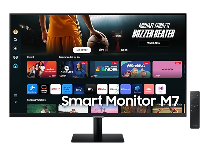 Gambar monitor Samsung Smart Monitor M7 di meja ruang tamu atau kamar tidur, menampilkan aplikasi produktivitas (seperti Excel) dan layanan streaming (seperti Netflix) secara bersamaan, menekankan fun
