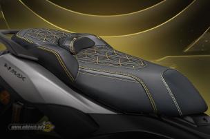 Jok motor custom dengan pola jahitan unik dan perpaduan warna yang menarik.