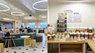 Interior kafe yang modern dengan beberapa orang sedang bekerja menggunakan laptop di meja, terlihat nyaman dan produktif.