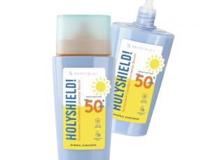 Gambar botol Somethinc Holyshield! Sunscreen Comfort dengan pipet yang mengeluarkan tekstur seperti serum, menonjolkan manfaat skincare-nya, dengan latar belakang samar Jakarta Barat.