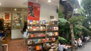 Gambar interior Kineruku yang nyaman dan artistik dengan rak buku dan tempat duduk.