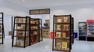 Gambar interior toko buku bergaya industrial dengan pajangan seni.